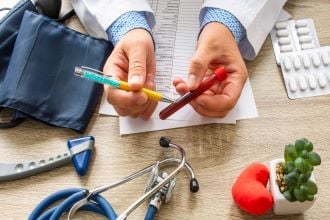 Medical professional examining blood sample