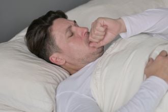man sleeping with breathing problem
