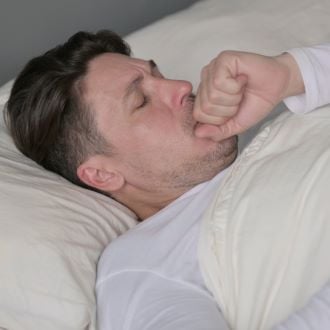man sleeping with breathing problem