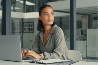 woman looking away while working