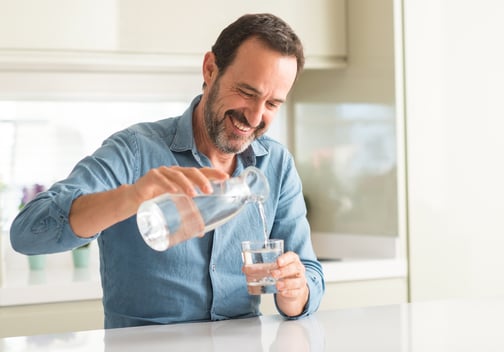 man-pouring-water